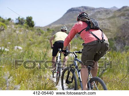 mountain bikers on dirt path View Large Photo Image Stock Image - mountain bikers on dirt path. Fotosearch