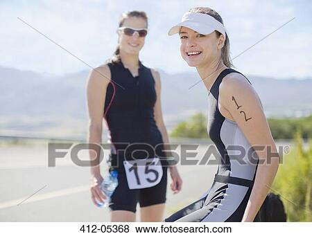 Stock Photo - Runners smiling together outdoors. Fotosearch