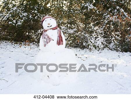 Stock Photo - Snowman wearing hat and scarf. Fotosearch