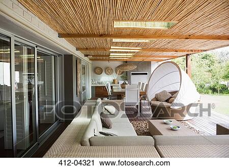 Stock Image - Sofa and chairs on modern patio. Fotosearch