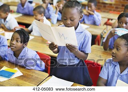 Stock Image - Student reading aloud in class. Fotosearch