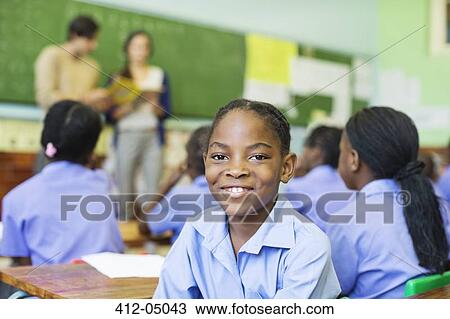 Student smiling in class View Large Photo Image Stock Image - Student smiling in class. Fotosearch