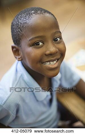 Student smiling in class View Large Photo Image Stock Photo - Student smiling in class. Fotosearch