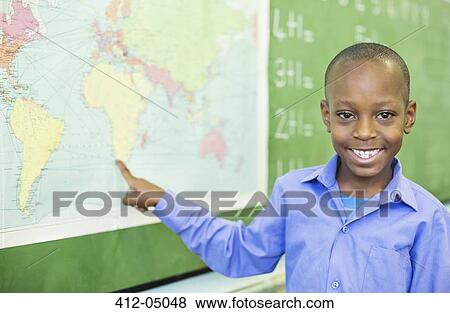 Student using world map in class View Large Photo Image Stock Photo - Student using world map in class. Fotosearch
