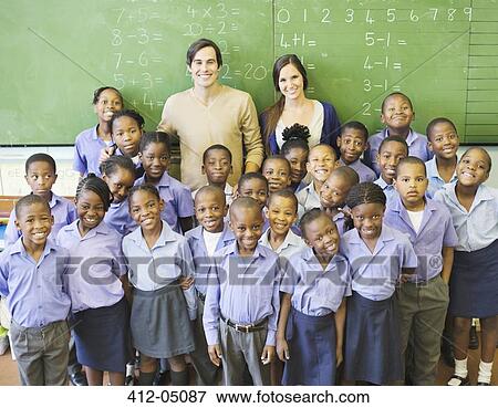 Students and teachers smiling in class View Large Photo Image Stock Photo - Students and teachers smiling in class. Fotosearch