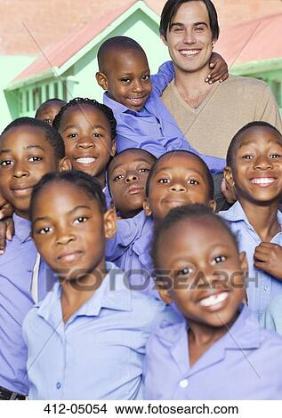 Picture - Students and teachers smiling outdoors. Fotosearch