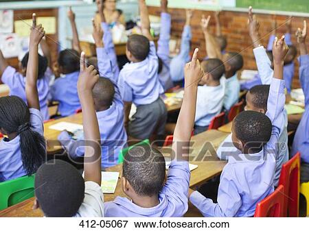 Students raising hands in class View Large Photo Image Stock Photo - Students raising hands in class. Fotosearch