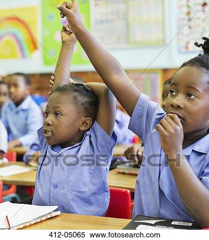 Students raising hands in class View Large Photo Image Stock Photography - Students raising hands in class. Fotosearch