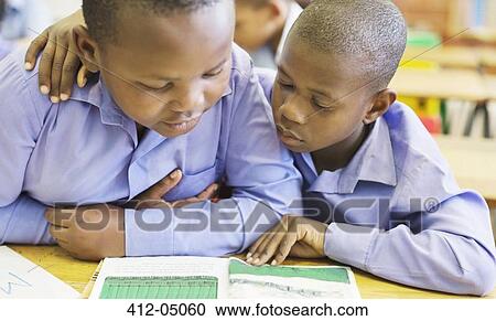 Students reading together in class View Large Photo Image Stock Image - Students reading together in class. Fotosearch