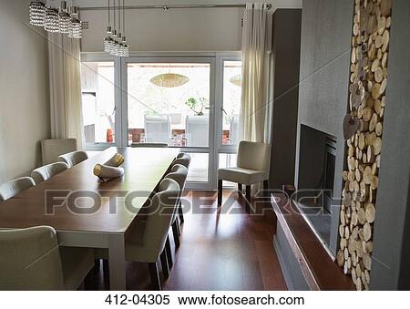 Stock Photography - Table and chairs in modern dining room. Fotosearch