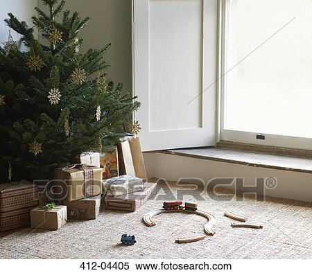 Train set and Christmas gifts under tree View Large Photo Image Stock Photography - Train set and Christmas gifts under tree. Fotosearch