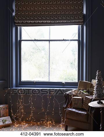 Window with fairy lights and Christmas gifts View Large Photo Image Stock Image - Window with fairy lights and Christmas gifts. Fotosearch