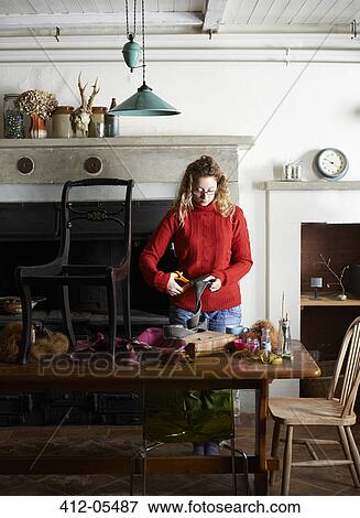 Woman cutting upholstery webbing View Large Photo Image Stock Photo - Woman cutting upholstery webbing. Fotosearch