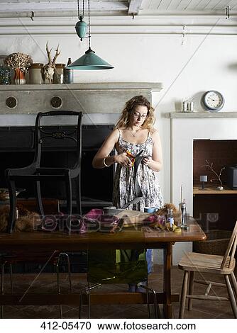Woman decorating chair with fabric View Large Photo Image Stock Image - Woman decorating chair with fabric. Fotosearch