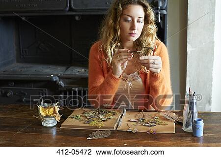 Woman decorating dried herbs and flowers View Large Photo Image Stock Image - Woman decorating dried herbs and flowers. Fotosearch
