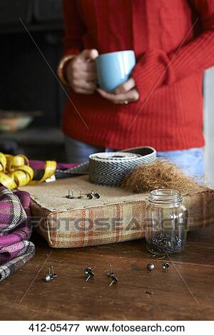 Woman having cup of coffee and crafting View Large Photo Image Stock Photo - Woman having cup of coffee and crafting. Fotosearch