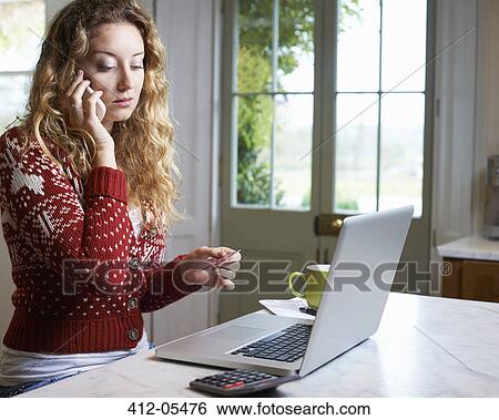 Woman shopping on telephone View Large Photo Image Stock Photograph - Woman shopping on telephone. Fotosearch