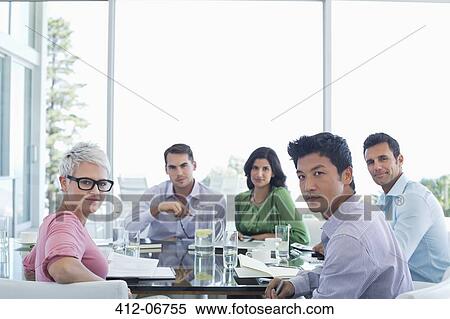 Business people sitting in meeting View Large Photo Image Stock Photography - Business people sitting in meeting. Fotosearch