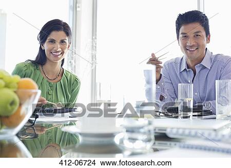 Business people smiling in meeting View Large Photo Image Picture - Business people smiling in meeting. Fotosearch