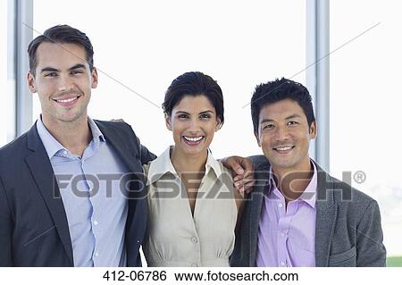 Business people smiling in office View Large Photo Image Stock Photograph - Business people smiling in office. Fotosearch