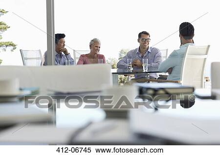 Business people talking in meeting View Large Photo Image Stock Photography - Business people talking in meeting. Fotosearch
