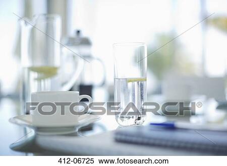 Coffee cups and water glasses on meeting table View Large Photo Image Stock Photography - Coffee cups and water glasses on meeting table. Fotosearch