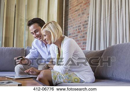 Couple shopping online with tablet computer View Large Photo Image Stock Photograph - Couple shopping online with tablet computer. Fotosearch