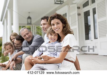 Family relaxing on porch together View Large Photo Image Stock Photo - Family relaxing on porch together. Fotosearch