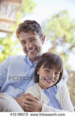 Father and daughter hugging outdoors View Large Photo Image Stock Image - Father and daughter hugging outdoors. Fotosearch