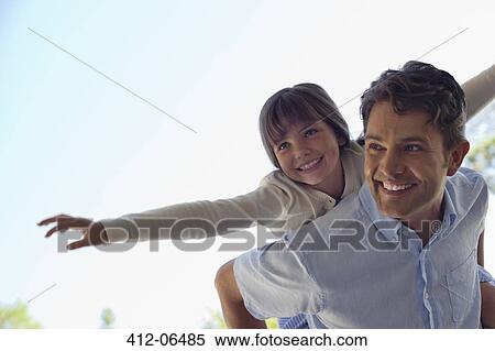 Stock Photography - Father and son playing outdoors. Fotosearch