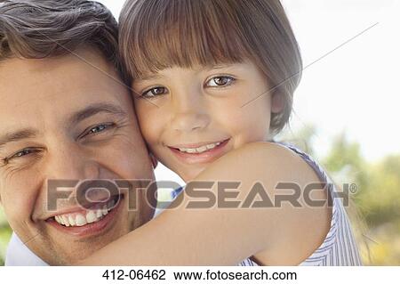 Father holding daughter outdoors View Large Photo Image Stock Image - Father holding daughter outdoors. Fotosearch