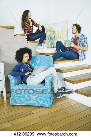 Friends relaxing together on steps View Large Photo Image Stock Photo - Friends relaxing together on steps. Fotosearch
