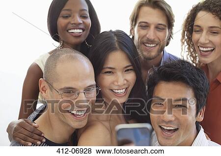 Friends taking picture together View Large Photo Image Stock Photo - Friends taking picture together. Fotosearch