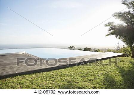Infinity pool overlooking hillside View Large Photo Image Stock Image - Infinity pool overlooking hillside. Fotosearch