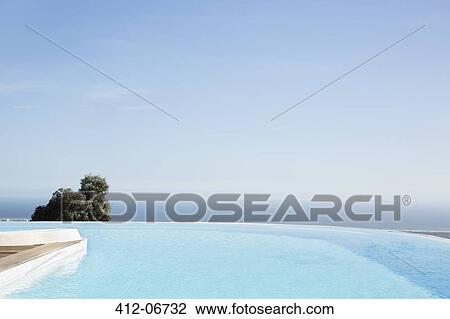 Infinity pool overlooking hillside View Large Photo Image Stock Image - Infinity pool overlooking hillside. Fotosearch
