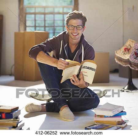 Man reading in new home View Large Photo Image Stock Image - Man reading in new home. Fotosearch