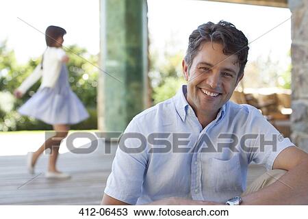 Man smiling on porch View Large Photo Image Stock Image - Man smiling on porch. Fotosearch