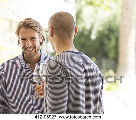 Men drinking wine together View Large Photo Image Stock Photo - Men drinking wine together. Fotosearch