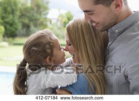 Mother and daughter touching noses outdoors View Large Photo Image Picture - Mother and daughter touching noses outdoors. Fotosearch