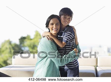 Mother and son hugging outdoors View Large Photo Image Stock Photo - Mother and son hugging outdoors. Fotosearch