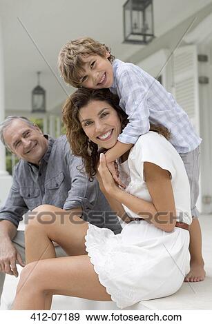 Mother and son smiling on porch View Large Photo Image Stock Photo - Mother and son smiling on porch. Fotosearch