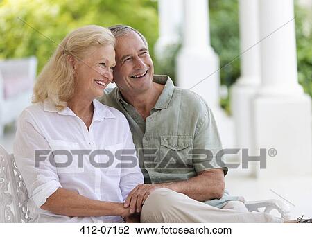 Older couple hugging on porch View Large Photo Image Stock Image - Older couple hugging on porch. Fotosearch