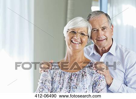 Stock Image - Older couple smiling together indoors. Fotosearch