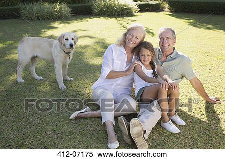 Older couple smiling with granddaughter in backyard View Large Photo Image Stock Photography - Older couple smiling with granddaughter in backyard. Fotosearch