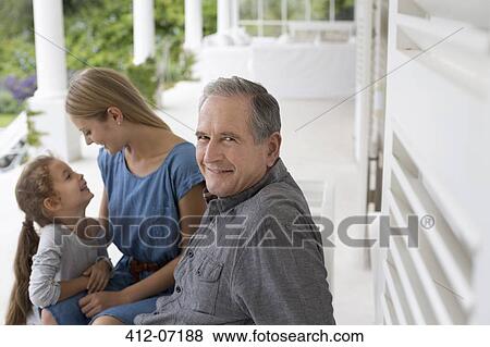 Older man smiling on porch View Large Photo Image Stock Photo - Older man smiling on porch. Fotosearch