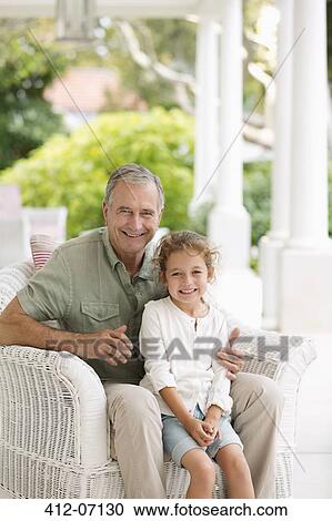 Older man with granddaughter on porch View Large Photo Image Stock Image - Older man with granddaughter on porch. Fotosearch