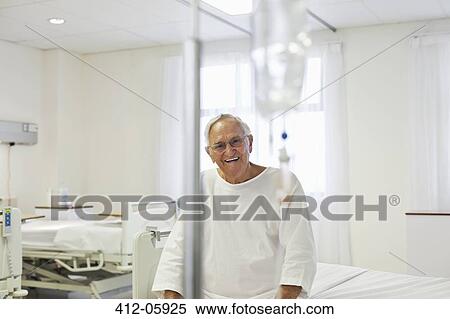 Older patient sitting on bed in hospital room View Large Photo Image Stock Photography - Older patient sitting on bed in hospital room. Fotosearch