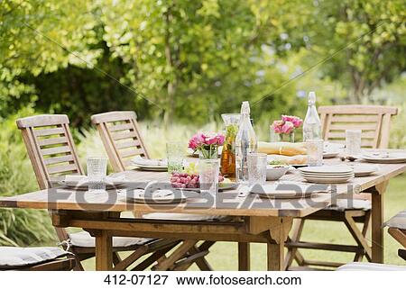 Set table in backyard View Large Photo Image Stock Photo - Set table in backyard. Fotosearch