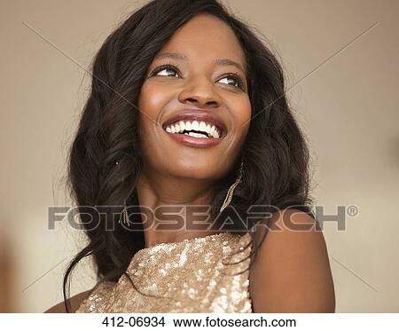 Smiling woman wearing evening gown View Large Photo Image Picture - Smiling woman wearing evening gown. Fotosearch