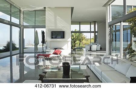 Stock Image - Sofas and television in modern living room. Fotosearch